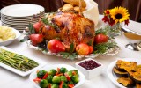 If you're trying to lose weight, you might imagine Thanksgiving as a kind of no-man's land of diet disasters just waiting to happen. You imagine yourself standing nervously by the veggie platter, hanging on for dear life to a few stalks of celery while your family and friends gorge themselves on turkey, stuffing, and pumpkin pie. But don't worry! Just because it's Thanksgiving doesn't mean you have to give up your weight loss plan, or resign yourself to a dismal feast of crudités. There are a number of ways you can stick to your weight loss plan and eat the foods you like - which is something that'll make this Thanksgiving one you can truly be thankful for. Tip #1: Set aside Thanksgiving as a "cheat day" If you don't have "cheat days" built into your weight loss plan, now is a great time to start. Cheat days are days when you relax the rules of your weight loss plan. Contrary to what you might think, cheat days won't hold you back from ultimately reaching your weight loss goals - many people find that they offer just the right amount of incentive so they can stick with their weight loss plan for the long haul, not just for a few weeks or months. The key word here is "relax" - you're not completely letting go of your healthy eating plan altogether. The idea is to enjoy a larger amount or variety of the foods you like in moderation. So set aside Thanksgiving as a cheat day - use it as an occasion to enjoy the foods your wouldn't normally eat, and rest assured that one day of reasonable indulgences won't stand in the way of losing inches from your waist. Step #2: Go in with a game plan. Once you set aside Thanksgiving as a cheat day, your next step is to go in with a game plan. If you haven't done so already, you'll probably want to sign up for a calorie counting program. Before turkey day rolls around, figure out what your overall calorie goal for that day will be. This number will be different for everyone. For some, a cheat day might mean "overspending" by 500 calories; for others - especially those who are able to fit a good workout into Thanksgiving Day - this might mean overspending by 1,000 calories or more. Once you've figured out your target calories, come up with a list of possible foods you might want to spend your calories on. Here's a tip: given that vegetables are generally both filling and lower in calories, try filling at least half of your dinner plate with salad and other green goodies. Using this strategy will give you more calories to spend on calorie-heavy treats like stuffing and pie. Going in with a game plan will help put you in the driver's seat of your weight loss plan - instead of eating mindlessly on Thanksgiving Day, you'll be making conscious choices about what you put into your body. Having a game plan will also make it easier to turn down unwanted second (or third!) helpings from overzealous, if well-intentioned, relatives. Step #3: Set yourself up for success - bring healthy choices to the table If you're the one in charge of cooking Thanksgiving dinner, this step will be easy - you'll have complete control over what goes on the table, and you'll have the chance to make any number of healthy culinary decisions for yourself and your family. However, if you're going to someone else's house for Thanksgiving, do yourself a favor and bring a healthy treat for everyone (including yourself!) to enjoy. Don't just make this a veggie platter (unless you love crudités) - aim to bring an alternate main dish, a hearty side dish, or a healthier version of a traditional Thanksgiving dessert. That way, you're setting yourself up to eat something that won't break your calorie bank and that you know you'll love. Your fellow dieters will thank you. Step #4: Ditch the football game, hit the great outdoors Fight the temptation to camp out in front of the television after dinner. If the weather's nice enough, gather a few family members and/or friends together for a post-dinner stroll, or, if you're up for it and you're not feeling too stuffed, a light game of touch football. You'll get to enjoy the crisp autumn air and beautiful fall colors - all while building cardiovascular health and burning a few extra calories. Step #5: Relax! Finally, remember that nobody's perfect. Even if you go in with a game plan, don't berate yourself if you don't follow it to the letter. Your goal shouldn't be perfection, but progress - you're working to build healthy habits that will last a lifetime, and a few slip-ups here and there won't spell doom to your weight loss goals. Take time to enjoy being with your family, and don't pass up a slice of your grandmother's homemade pumpkin pie just because you're worried you might go over your goal by a few calories. Eat well, eat mindfully, and have a bountiful Thanksgiving!