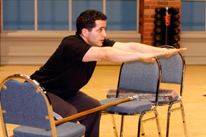 A great way to work on your squat form is to use a broomstick and two chairs.