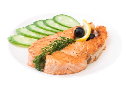 Appetizing Grilled Salmon with sliced cucumber, lemon and black