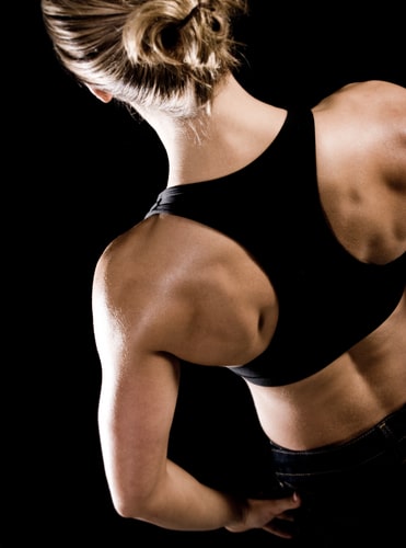 Muscular Back Of A Woman In Sportswear Stock Photo (121815