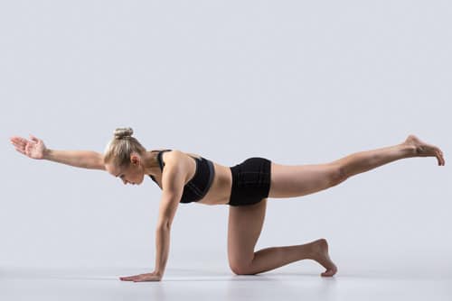 A woman doing plank abdominal exercises