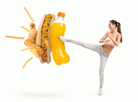 Girl kicking a giant sugar drink, hot dog, fries, and fries chicken fingers. 5 dietary mistakes that Age You Prematurely