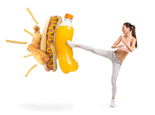 Girl kicking a giant sugar drink, hot dog, fries, and fries chicken fingers. 5 dietary mistakes that Age You Prematurely