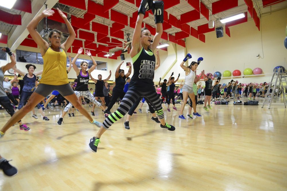 Cathe Friedrich leads a class at Four Seasons Fitness. Plyometric moves are a way to activate fast-twitch muscle fibers and build strength and power.