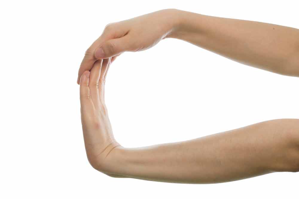 image of a female exercising her hand to improve her wrist strength