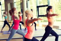 image of female exercisers working out doing yoga and aerobic exercis