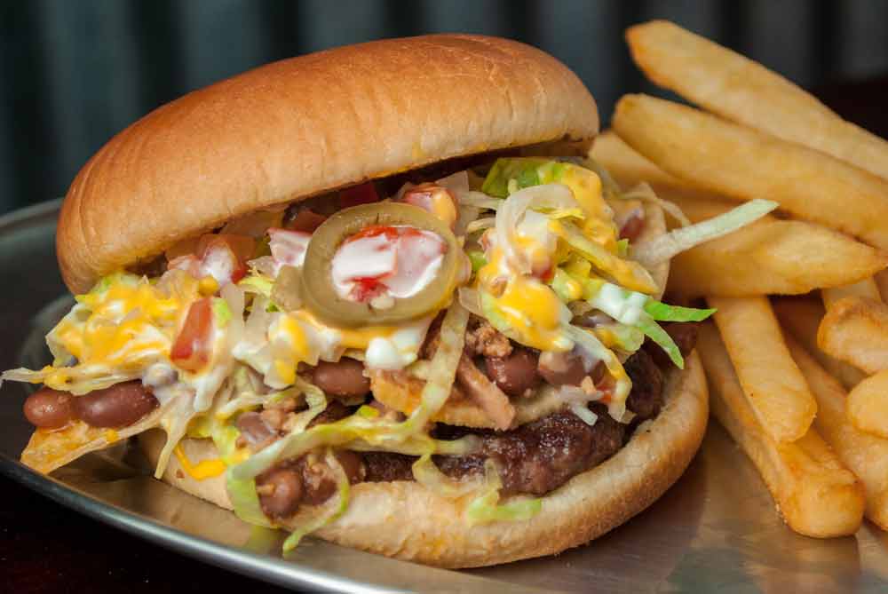 image of unhealthy burger and fries. Fast food is a major cause of overeating.