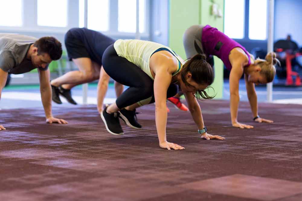 image of several female exercisers doing time expedient exercises like burpees