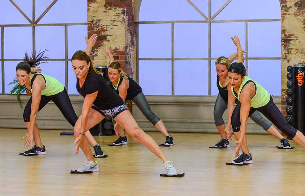 image of Cathe, Jenn,Brenda,Jai and Nicole in Fit Split Low Imapct & Metabolic Conditioning doing a high-intensity interval training workout