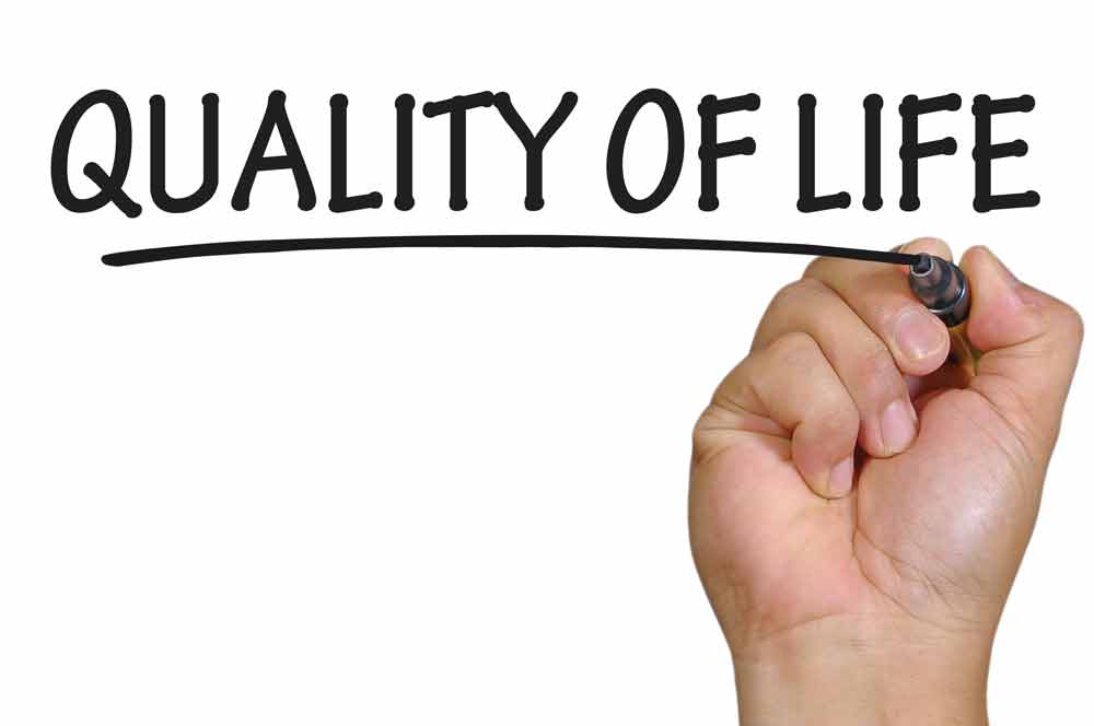 image of a hand writing the words Quality of Life to promote improving health span