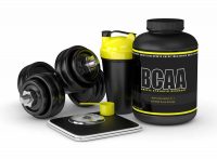 image of BCAA supplement bottle along with a dumbbell, weight scale and protein drink container