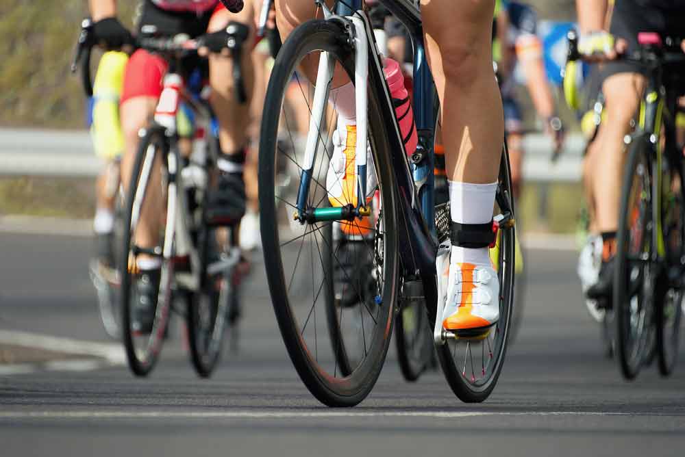 image of an outdoor cycle race, Does cycling help or hurt bone health