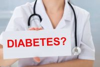 image of doctor holding a sign saying Diabetes