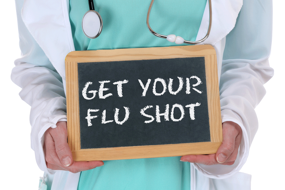 image of a doctor holding a get your flu shot mini blackboard sign
