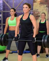 image of Cathe Friedrich doing a deadlift in Strong & Sweaty Total Body Giant Sets
