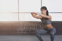 image of woman doing a squat without weights
