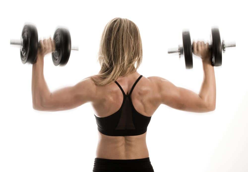 image of a female bodybuilder's muscular back lifting weights