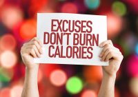 image of Excuses Don't Burn Calories placard with bokeh background