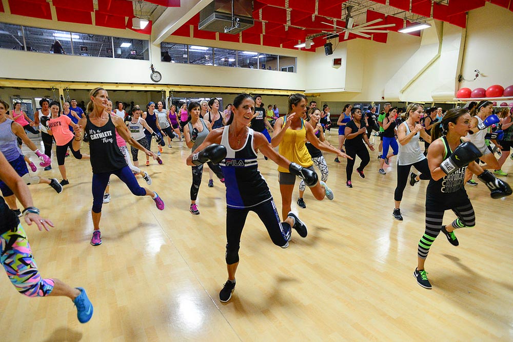 Image of Cathe Friedrich leading a workout during the Glassboro Road Trip. Is Being Physically Fit or Fatness More Important for Longevity?