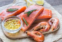 Sources of Omega-3 acid and fish oil (salmon, shrimps, Omega-3 pills)