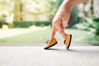 Woman hand finger walking with shoe concept. All women should be concerned about their risk of osteoporosis