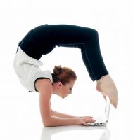 Businesswoman demonstrating flexibility doing yoga and typing on netbook